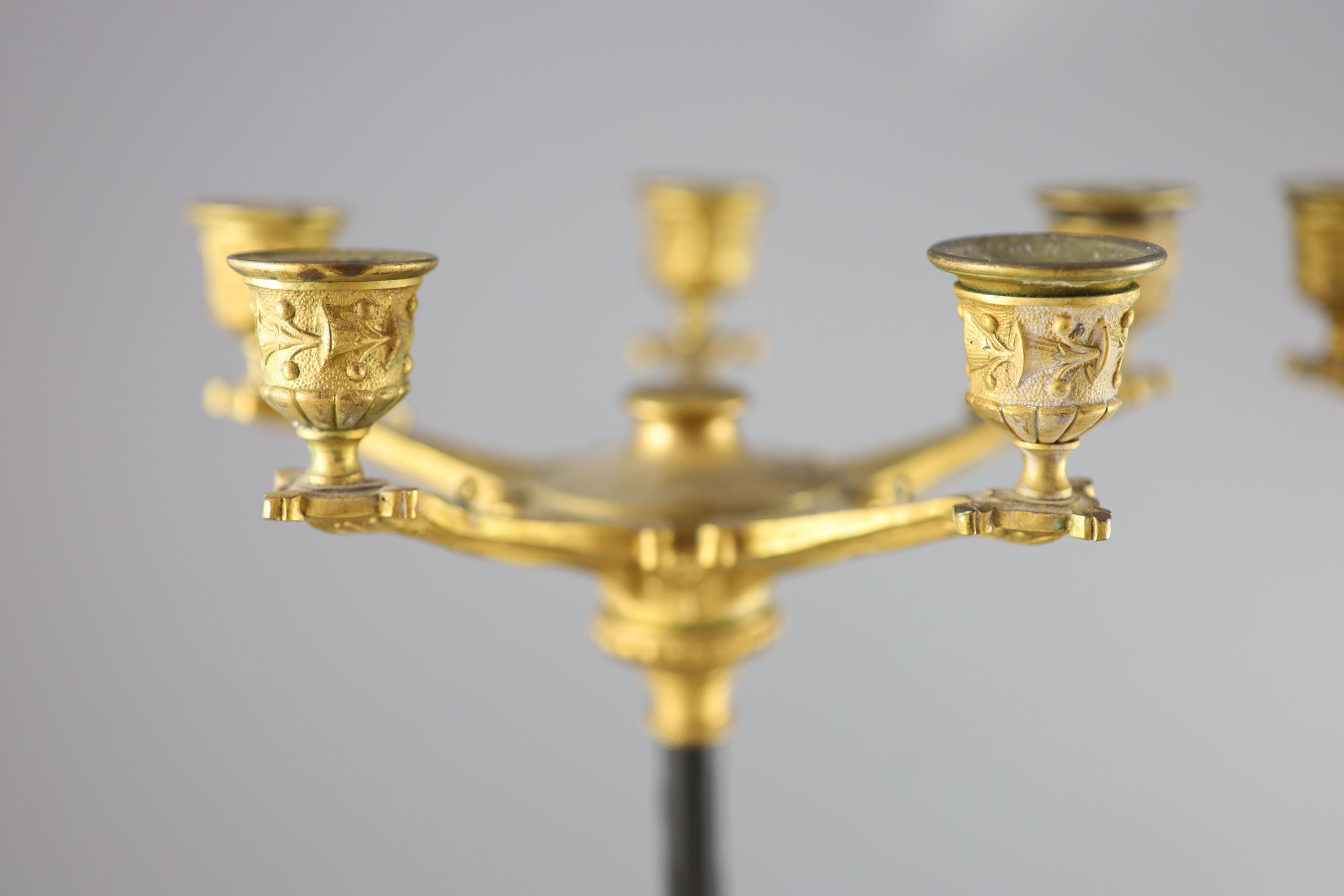 A pair of Barbedienne style five branch ormolu candelabra, 19th century, 52cm high